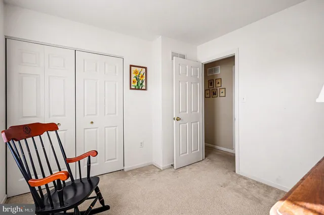 a view of room with furniture and windows