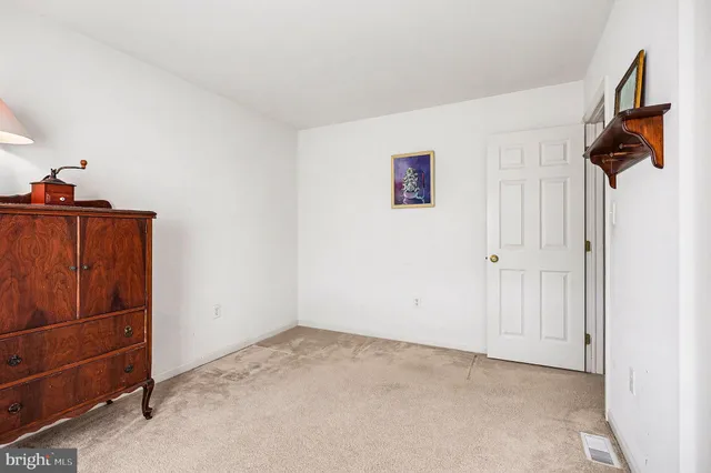 a view of storage and utility room with closet