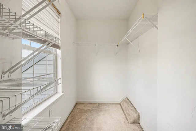 a view of a hallway with windows