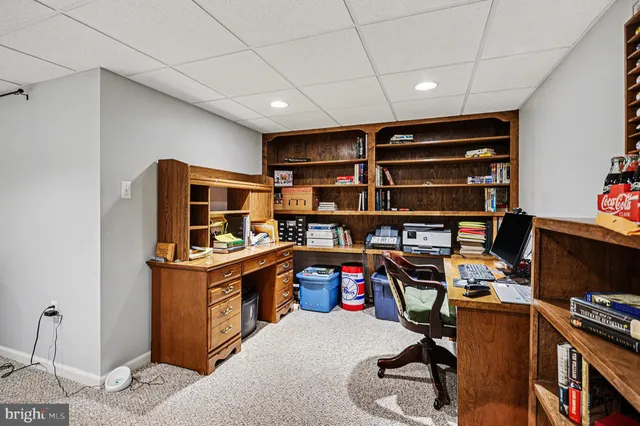 a view of a workspace with furniture
