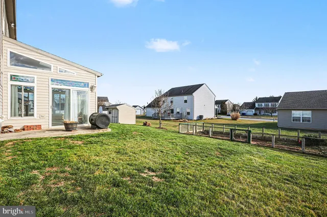a house view with a sitting space and garden