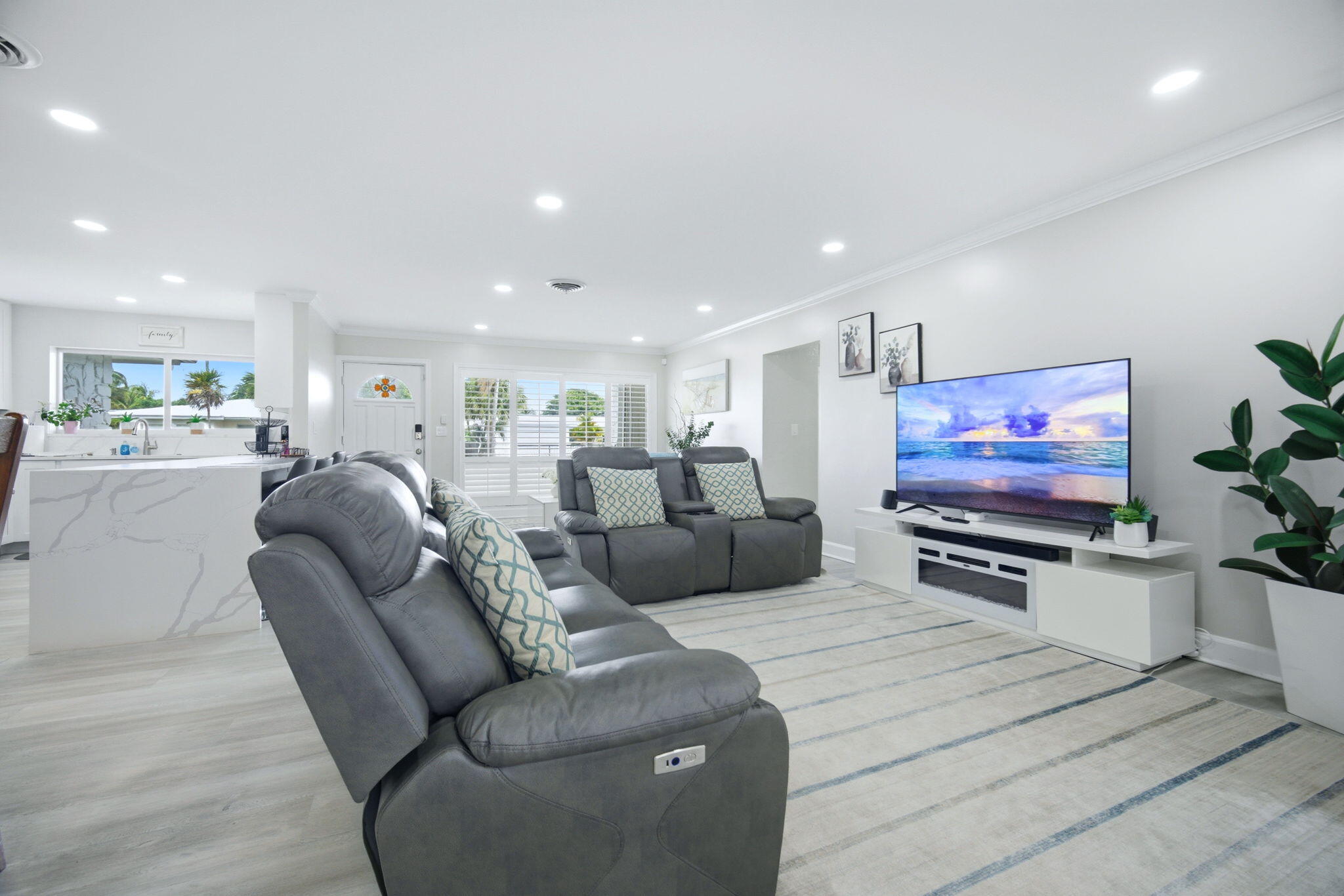 2740 Southeast 7th Street Pompano Beach, FL 33062 - Photo 17 of 34 a living room with furniture and a flat screen tv