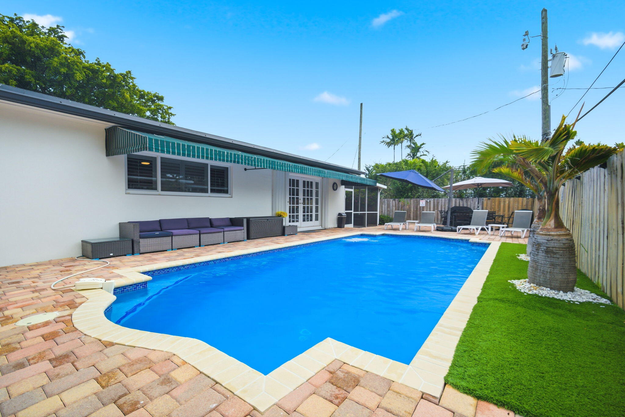 2740 Southeast 7th Street Pompano Beach, FL 33062 - Photo 19 of 34 a view of a house with pool and chairs