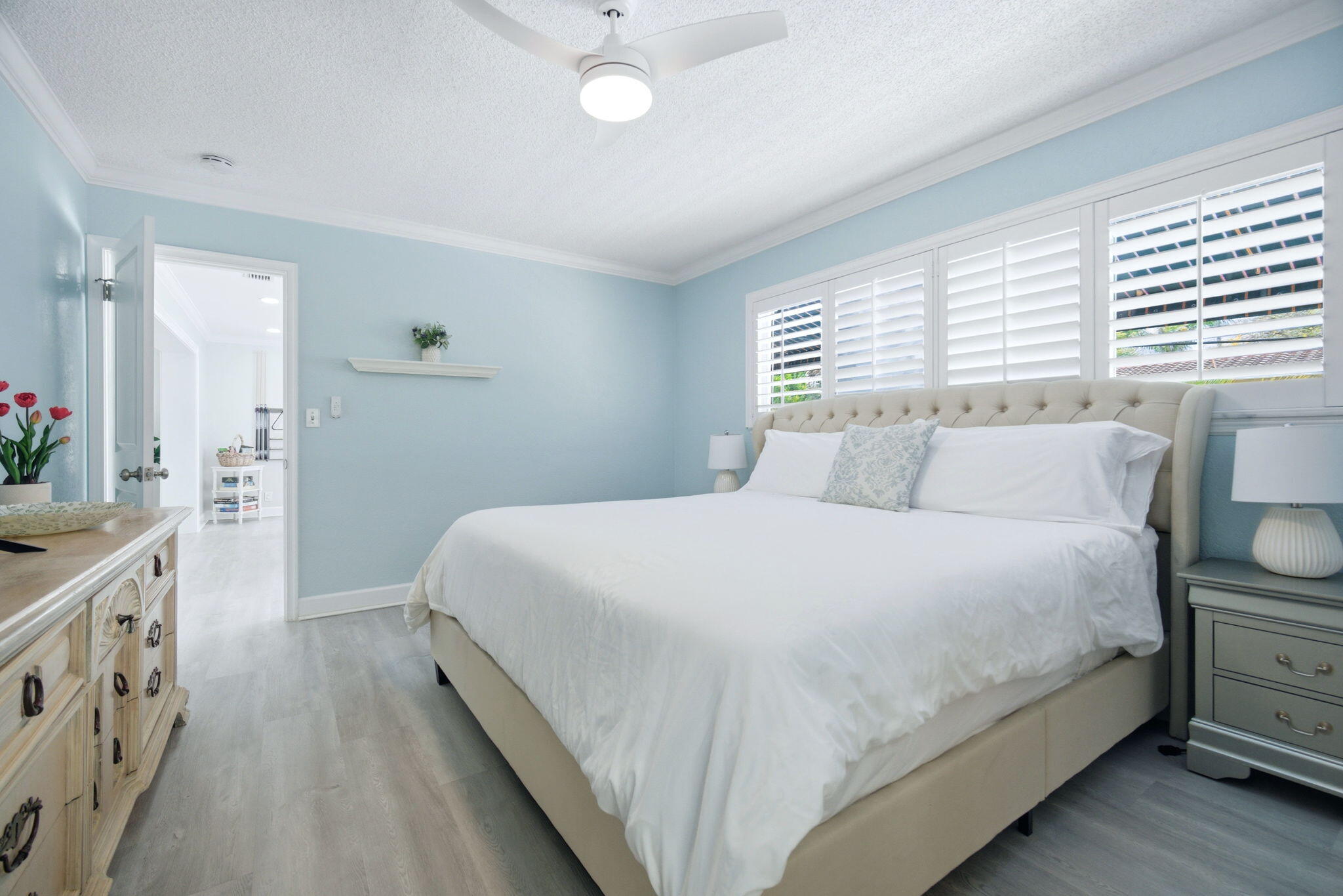 2740 Southeast 7th Street Pompano Beach, FL 33062 - Photo 21 of 34 a bedroom with a bed and a chandelier