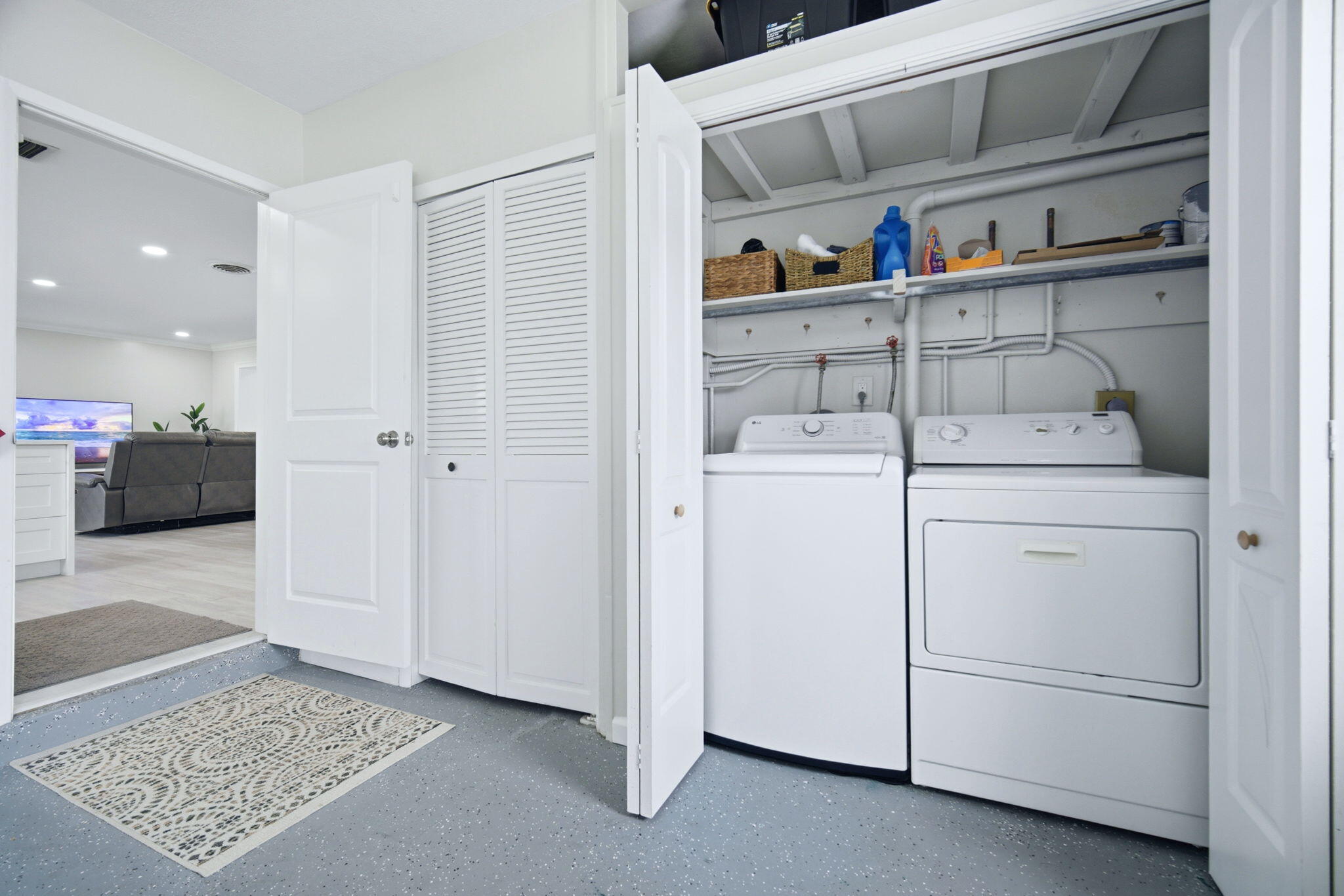 2740 Southeast 7th Street Pompano Beach, FL 33062 - Photo 26 of 34 a view of walk in closet with clothes and shoes
