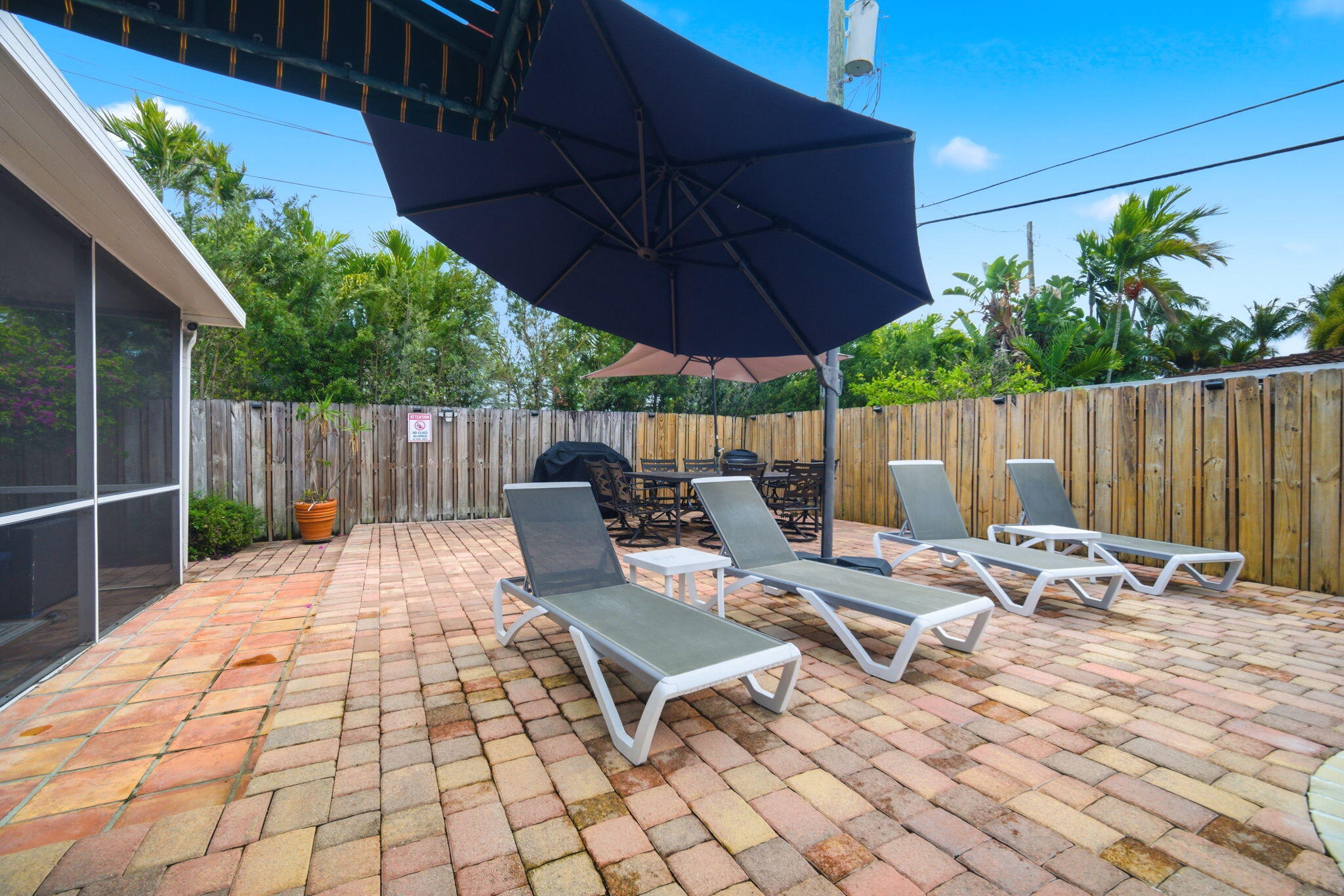 2740 Southeast 7th Street Pompano Beach, FL 33062 - Photo 28 of 34 a view of backyard with outdoor seating and wooden fence