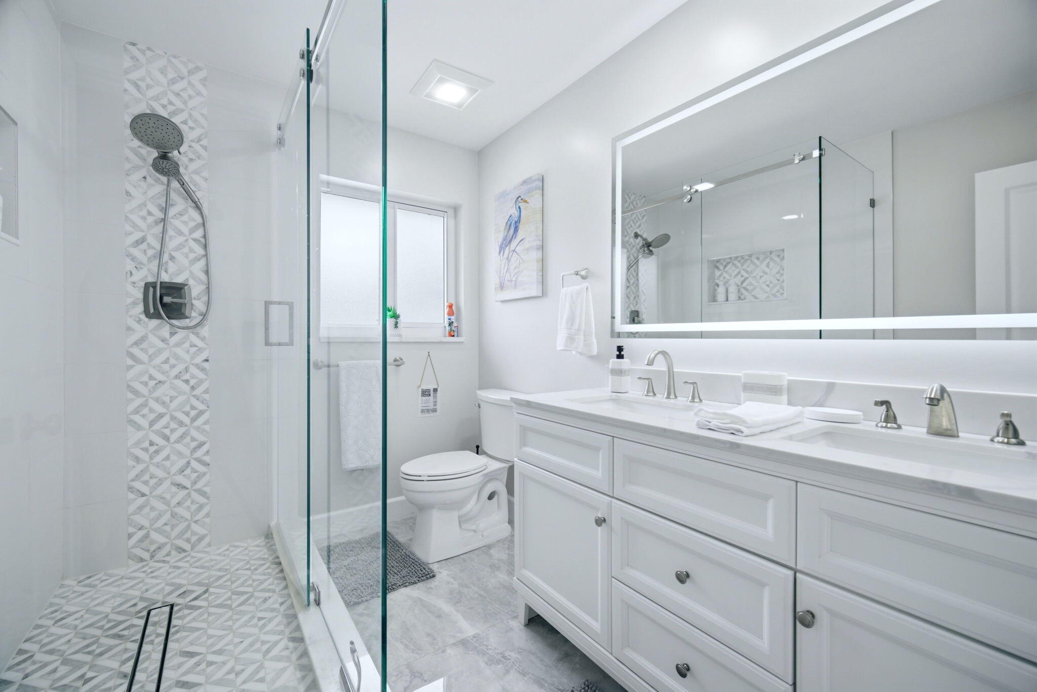 2740 Southeast 7th Street Pompano Beach, FL 33062 - Photo 7 of 34 a bathroom with a granite countertop sink a toilet and a shower