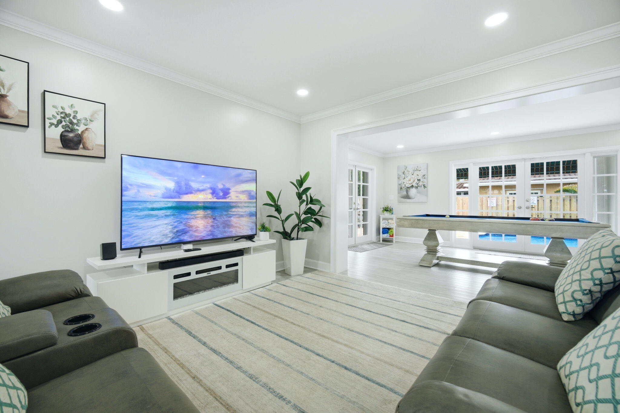 2740 Southeast 7th Street Pompano Beach, FL 33062 - Photo 10 of 34 a living room with furniture and a flat screen tv