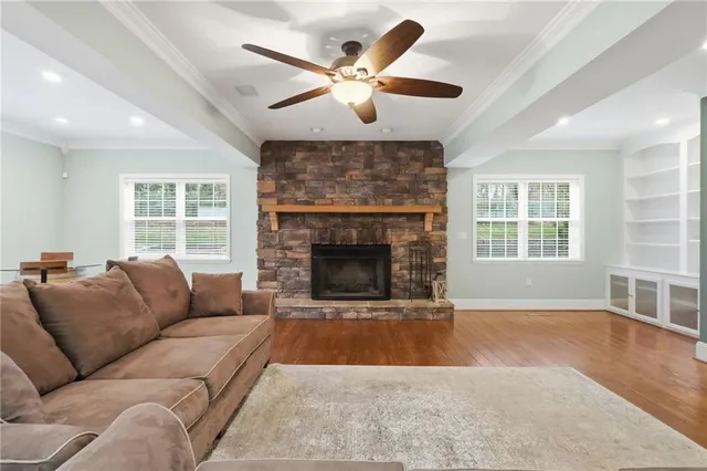 a living room with furniture and a fireplace
