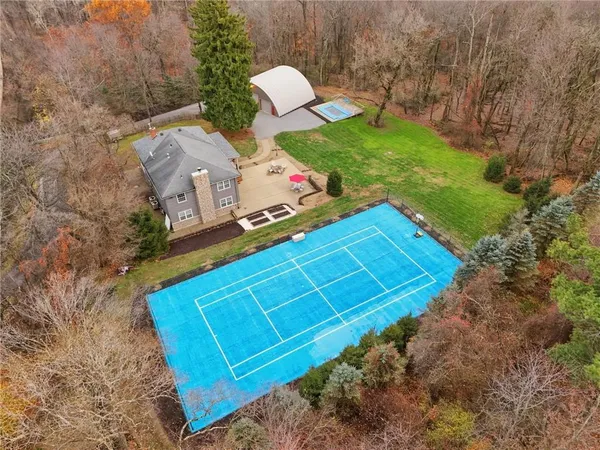 a view of a backyard with chairs