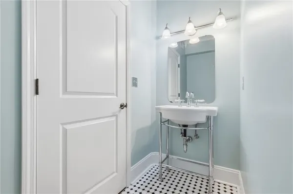 a bathroom with a sink and a mirror