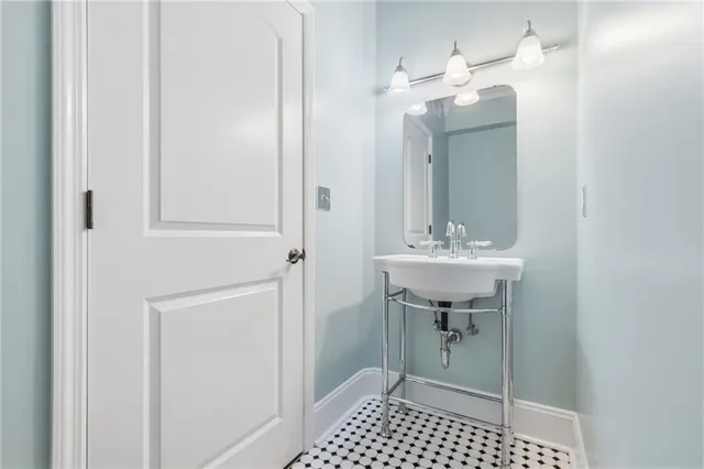 a bathroom with a sink and a mirror