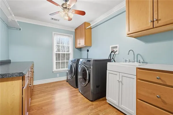 a utility room with closet dryer and washer