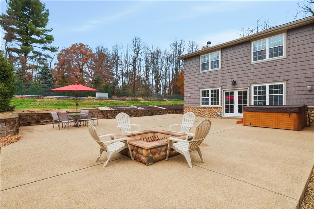 4021 Bakerstown Road Gibsonia, PA 15044 - Photo 38 of 43 a swimming pool with outdoor seating and yard