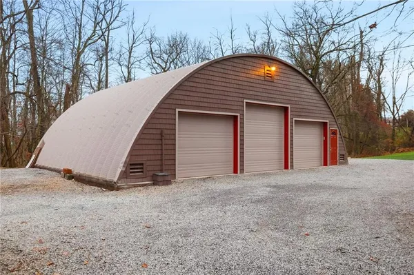 a view of a house with a yard and garage