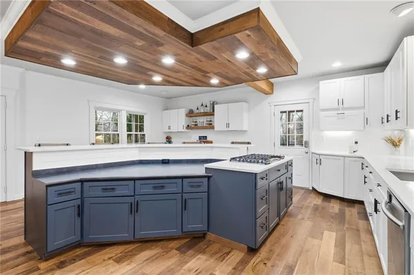 a kitchen with wooden cabinets and sink