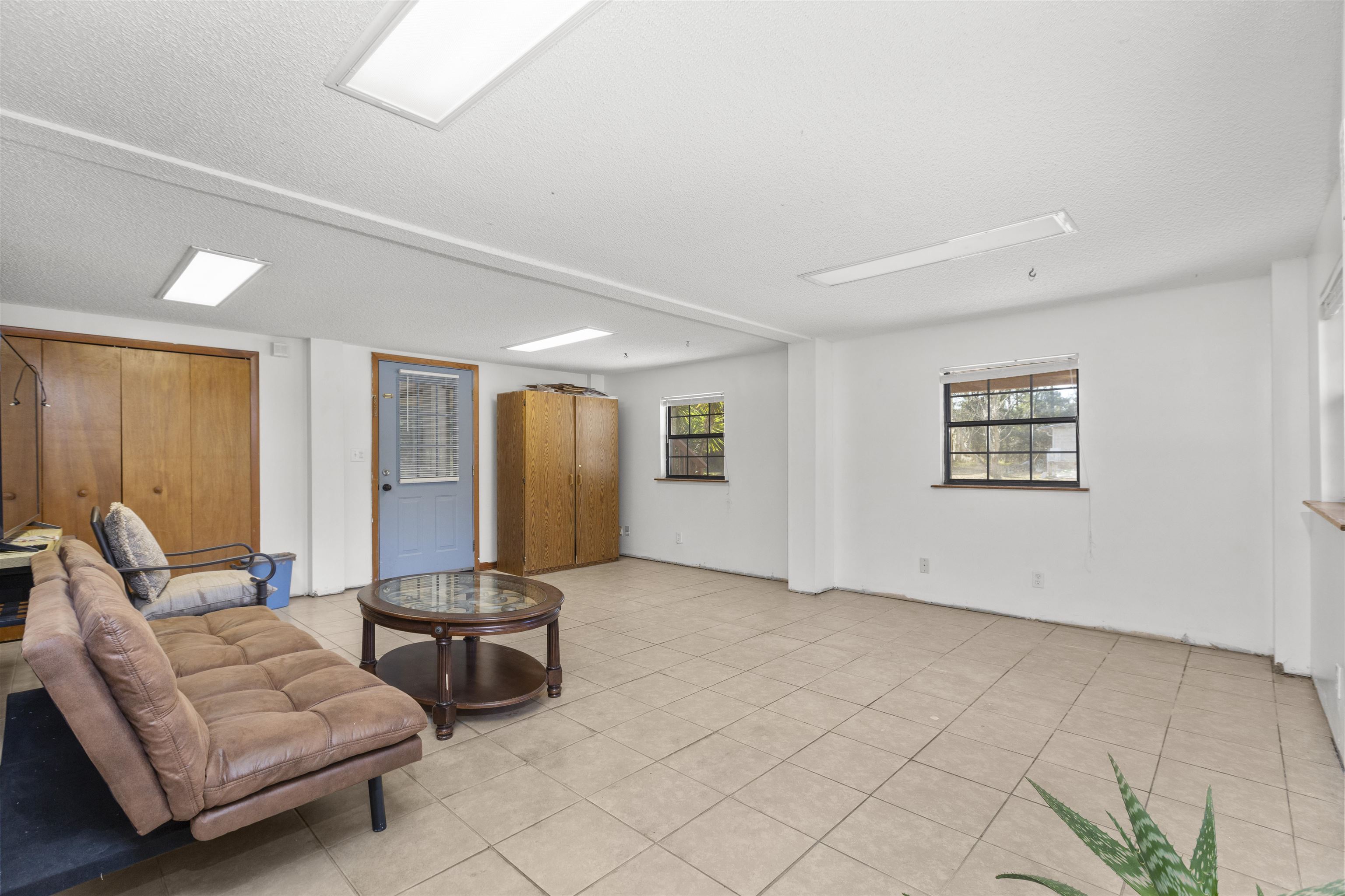 545 Ray Edwards Road St. Augustine, FL 32086 - Photo 14 of 78 Living room with a textured ceiling and light tile patterned flooring