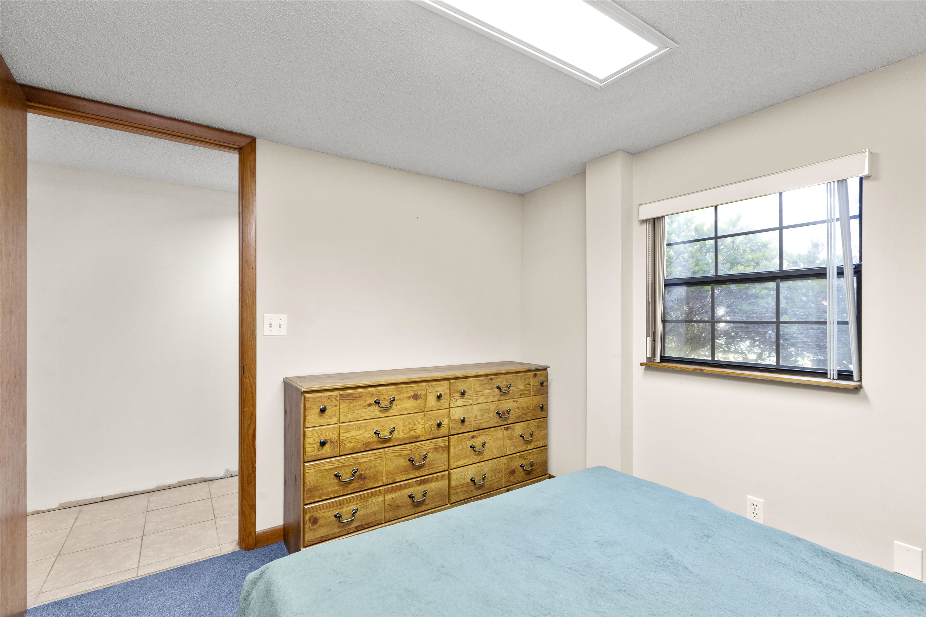 545 Ray Edwards Road St. Augustine, FL 32086 - Photo 20 of 78 Bedroom with a textured ceiling and tile patterned flooring