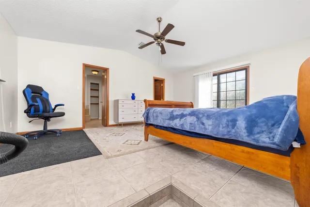 a view of a balcony with chairs and wooden floor