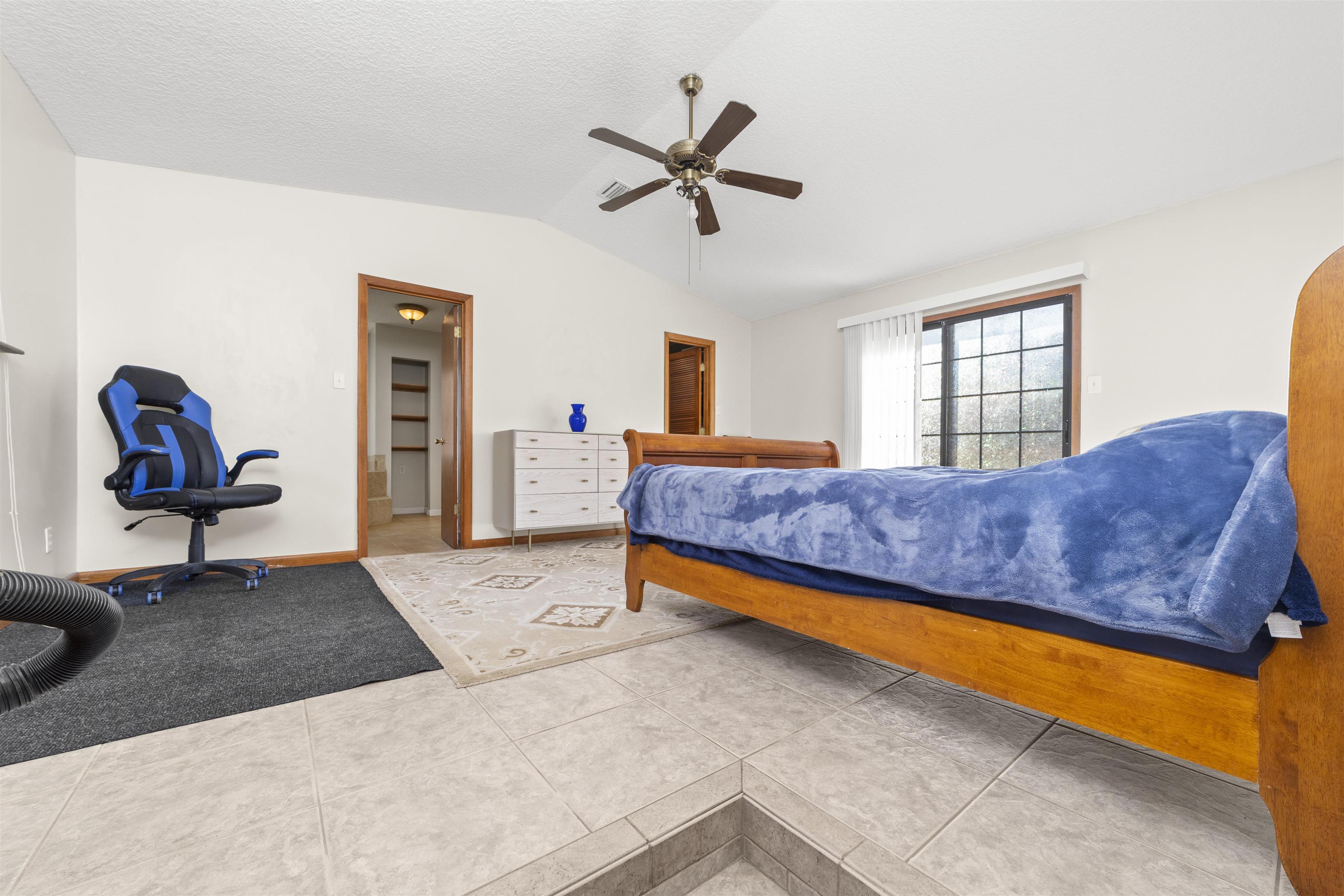 545 Ray Edwards Road St. Augustine, FL 32086 - Photo 37 of 78 Tiled bedroom with lofted ceiling, ceiling fan, and arched walkways