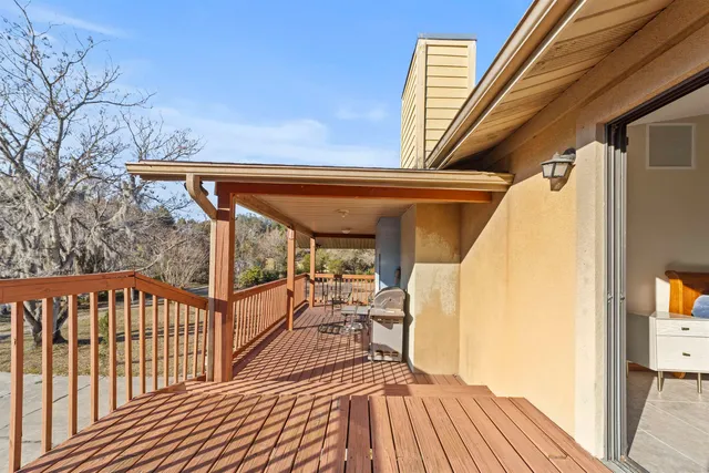 an aerial view of a house with yard and seating space