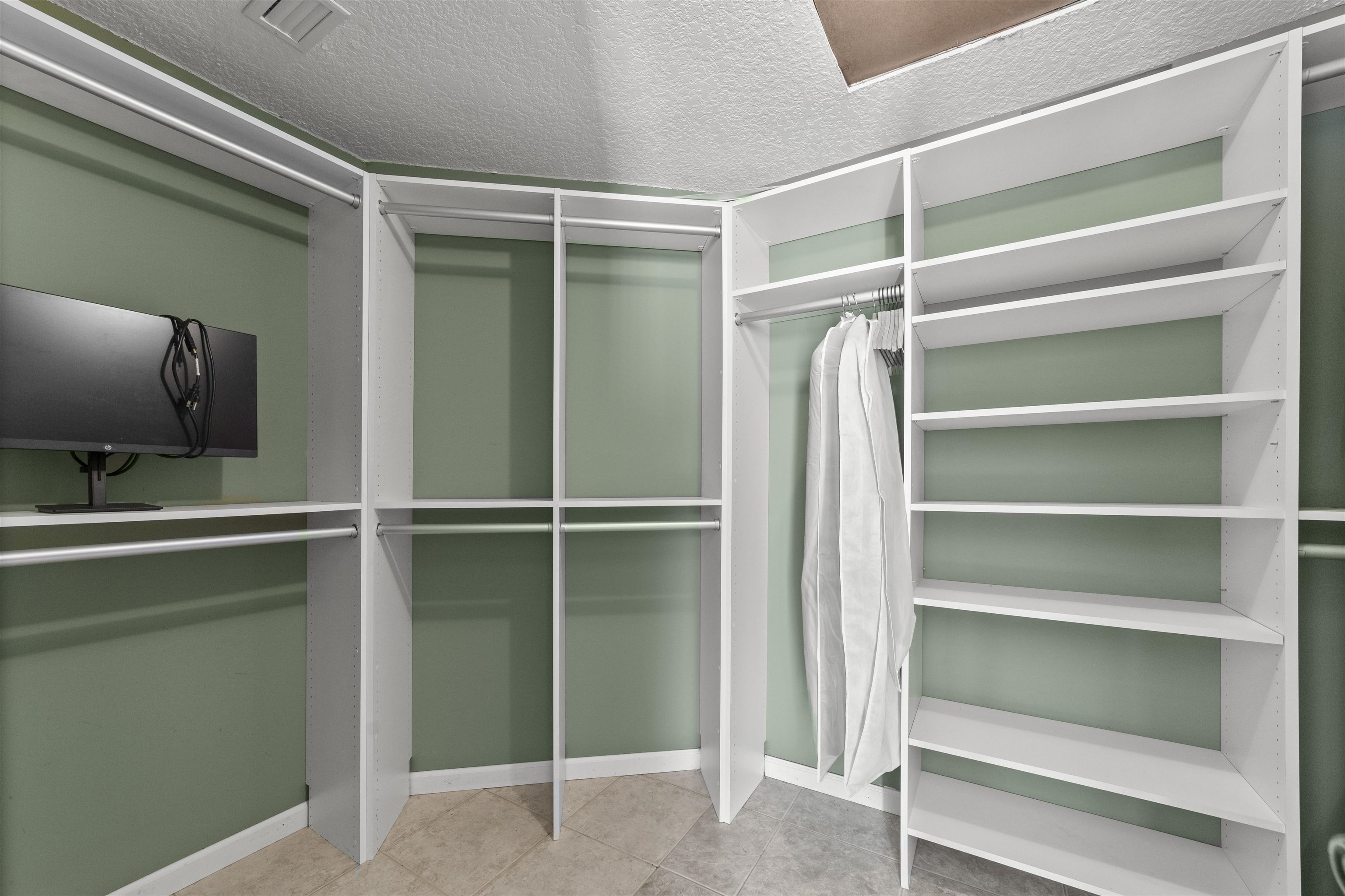 545 Ray Edwards Road St. Augustine, FL 32086 - Photo 51 of 78 Walk in closet featuring light tile patterned floors