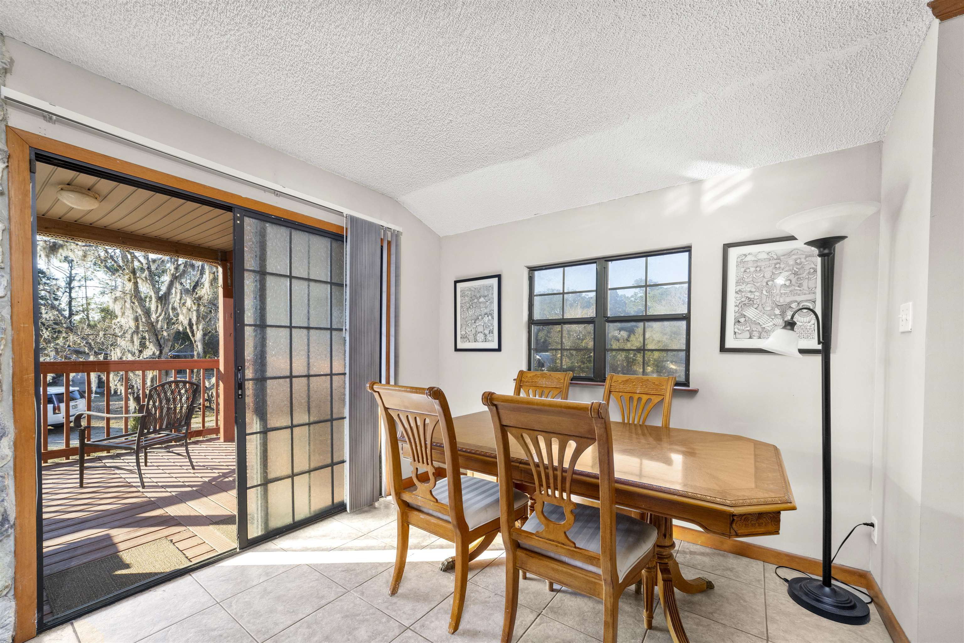 545 Ray Edwards Road St. Augustine, FL 32086 - Photo 52 of 78 Dining space featuring a textured ceiling, light tile patterned floors, and lofted ceiling