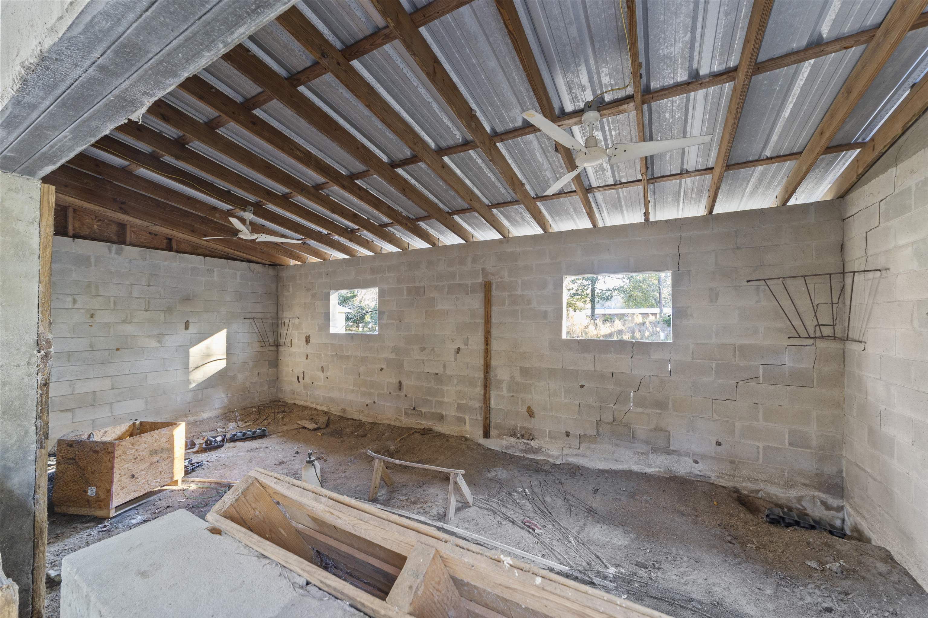 545 Ray Edwards Road St. Augustine, FL 32086 - Photo 62 of 78 Misc room featuring concrete block wall and ceiling fan