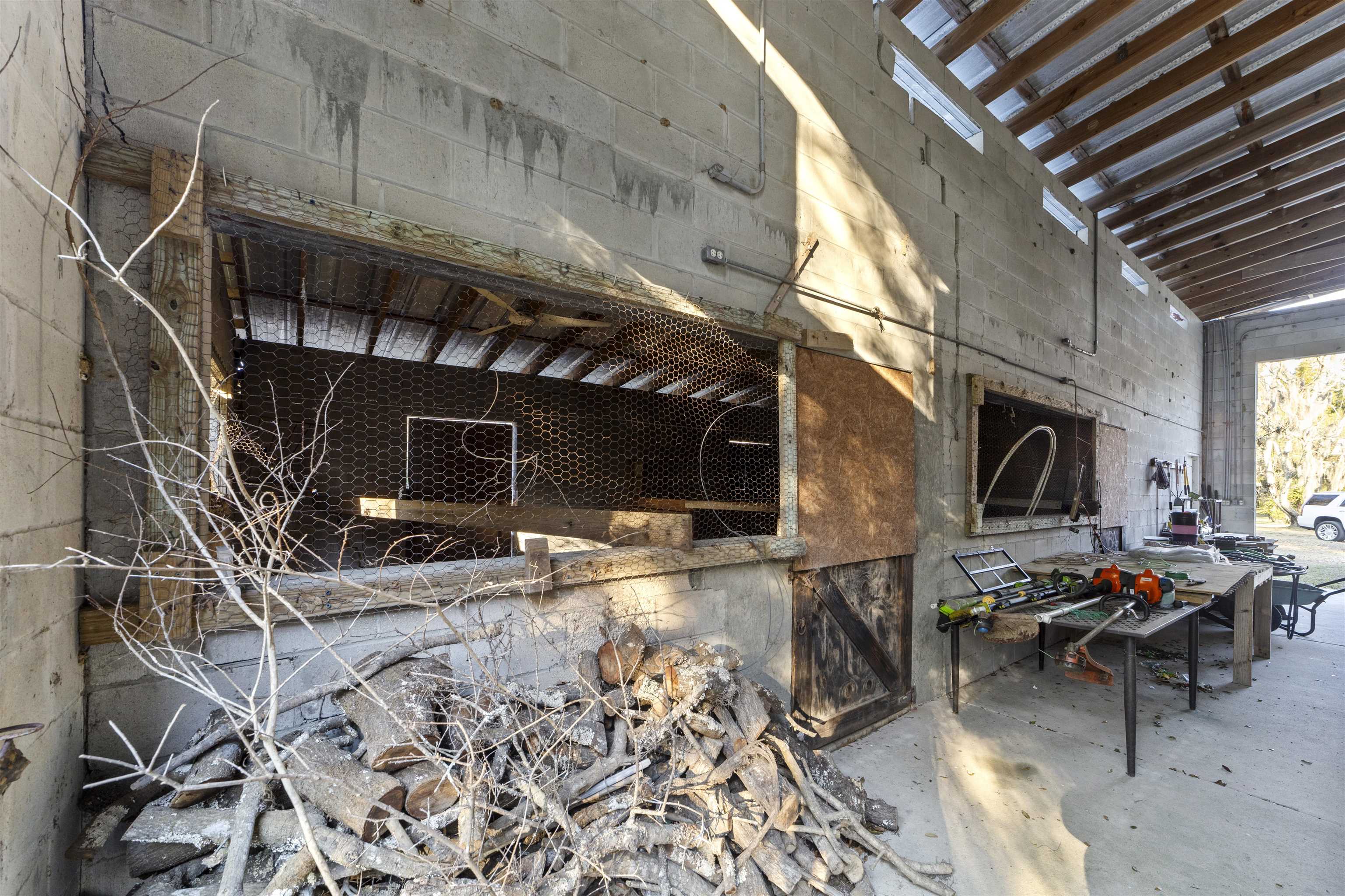 545 Ray Edwards Road St. Augustine, FL 32086 - Photo 63 of 78 Miscellaneous room featuring concrete flooring and a towering ceiling