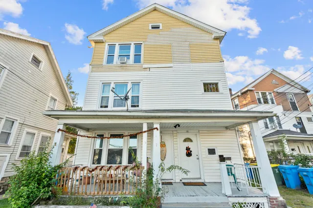 a front view of a house with a porch