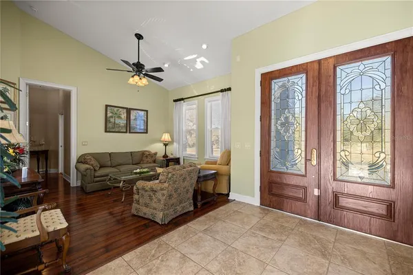 a view of a dining room with furniture wooden floor and chandelier