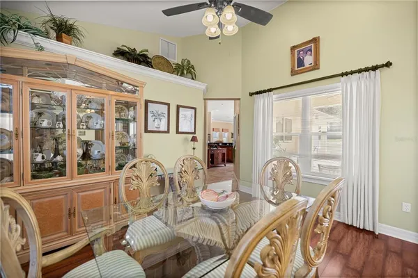 a living room with furniture a rug and a chandelier