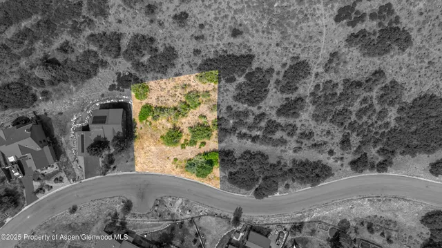 an aerial view of a house with mountain view