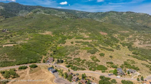 a view of a field with an ocean