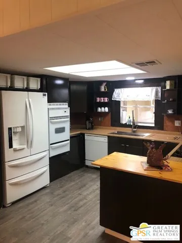 a kitchen with stainless steel appliances a refrigerator and stove
