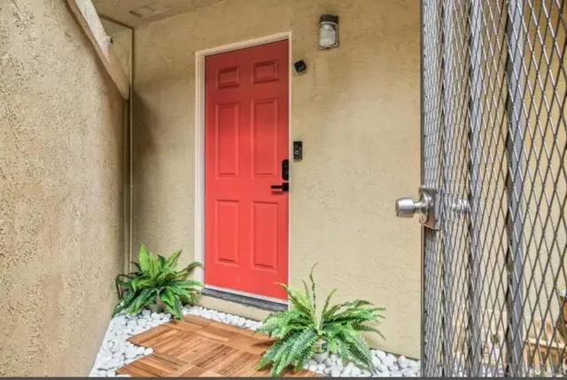 an entryway with a flower pot