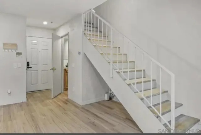 a view of entryway with wooden floor