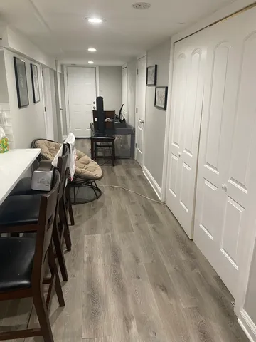 a view of a workspace with furniture and windows