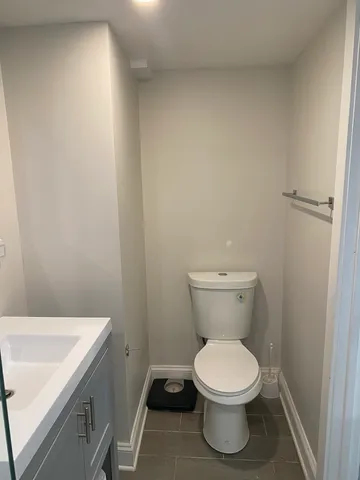 a bathroom with a toilet and a sink