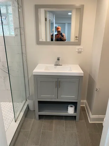 a utility room with a sink a washer and dryer