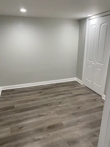 a view of room with wooden floor