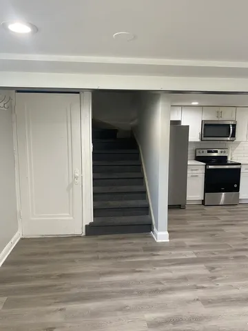 a view of kitchen and empty room