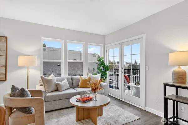 a living room with furniture and a potted plant