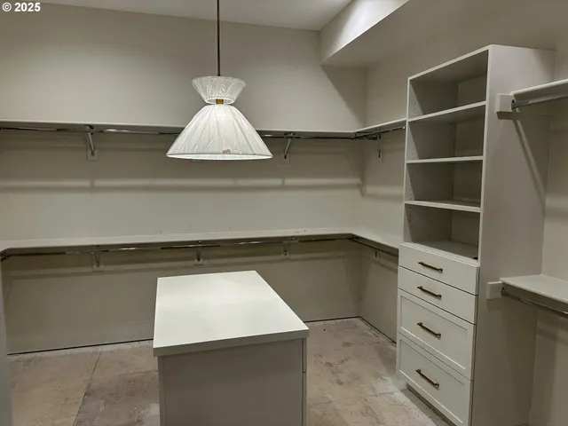 a kitchen with a cabinets and a chandelier