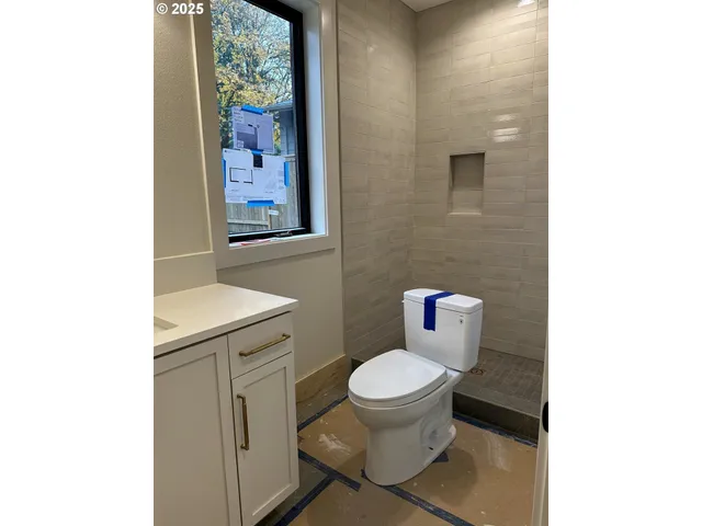 a bathroom with a toilet and a sink
