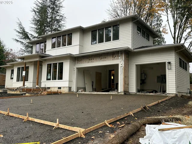 a front view of a house with a garage