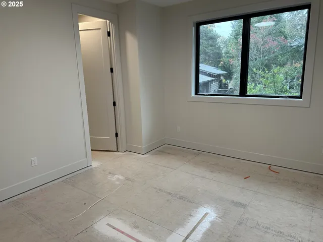 a view of an empty room with a window