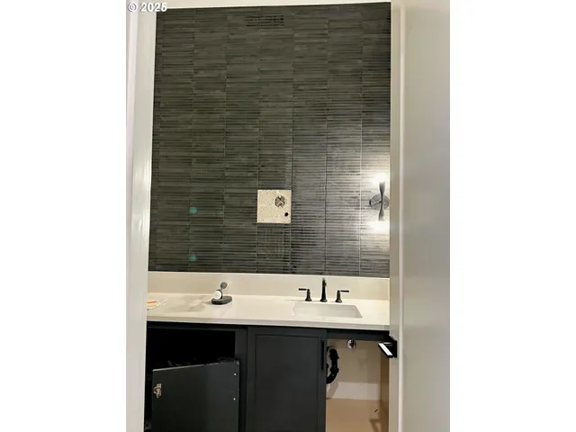 a bathroom with a sink and a mirror