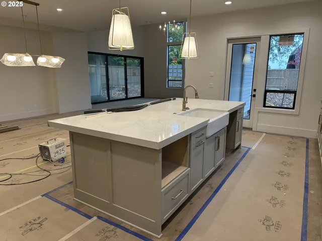 a kitchen with a stove and a sink