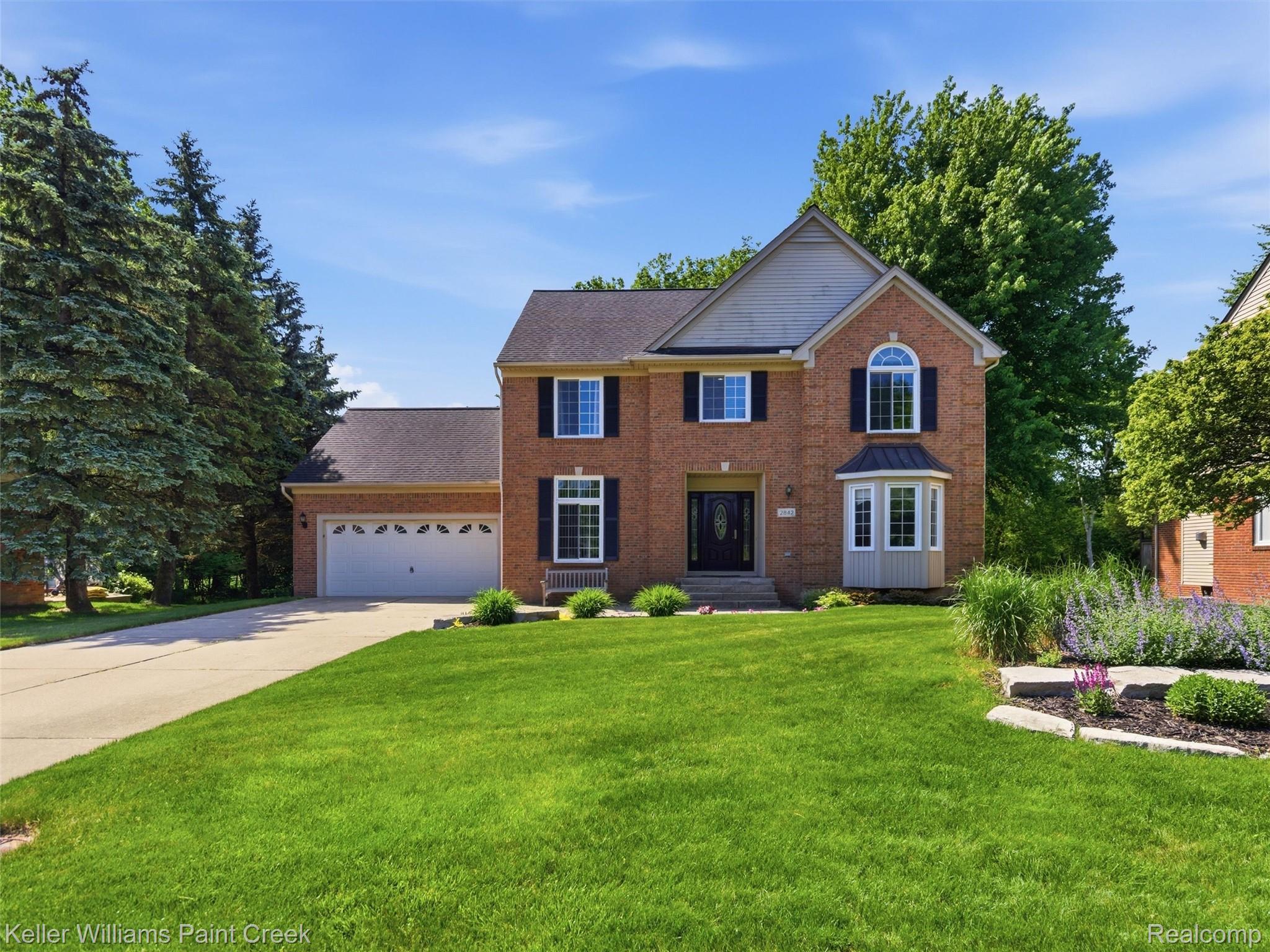 2842 Manorwood Road Troy, MI 48085 - Photo 2 of 72 Brick exterior with architectural shingles and a two-car garage